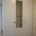 Armario abatible lacado en blanco fresado mod. Córdoba