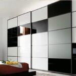 Armario de puertas correderas con cristal lacado en blanco , gris y negro