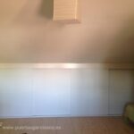 Frente abuhardillado en melamina blanco con perfiles y listeles en melamina gama MI